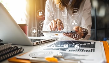 Digital marketing media in virtual screen.businesswoman hand working with mobile phone and modern compute with VR icon diagram at office in morning light