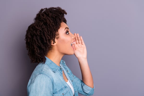 Profile side view of amazed surprised cheerful hipster lady scream shout ads hold hand share private information wear stylish trendy jeans denim clothing youth isolated grey background